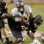 Arizona State wide receiver Rashad Ross (15) is tackled by Oregon's B.J. Kelley (23) during the first half of an NCAA college football game, Thursday, Oct. 18, 2012, in Tempe, Ariz. (AP Photo/Matt York)