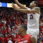  Arizona's Brandon Ashley (21) goes up for a shot as Texas Tech's Robert Turner (14) watches in the first half of an NCAA college basketball game on Tuesday, Dec. 3, 2013, in Tucson, Ariz. (AP Photo/John MIller)