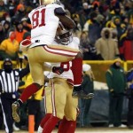  San Francisco 49ers wide receiver Anquan Boldin (81) jumps on tight end Vernon Davis (85) after Davis makes a touchdown catch during the second half of an NFL wild-card playoff football game against the Green Bay Packers, Sunday, Jan. 5, 2014, in Green Bay, Wis. (AP Photo/Jeffrey Phelps)
