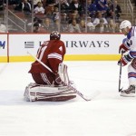 New York Rangers right-winger Marian Gaborik, right, of Slovakia, scores a goal against Phoenix Coyotes goalie Mike Smith, left, in the first period of an NHL hockey game Saturday, Dec. 17, 2011, in Glendale, Ariz. (AP Photo/Paul Connors)