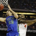 Florida Gulf Coast's Eddie Murray (23) shoots against Florida's Patric Young (4)during the first half of a regional semifinal game in the NCAA college basketball tournament, Friday, March 29, 2013, in Arlington, Texas. (AP Photo/Tony Gutierrez)