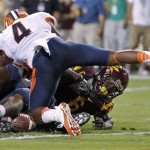 Illinois defensive back Patrick Nixon-Youman (4) dives on Arizona State running back Cameron Marshall (6) as Marshall fumbles on the goal line during the first half of an NCAA college football game, Saturday, Sept. 8, 2012, in Tempe, Ariz. (AP Photo/Matt York)
