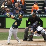Oakland Athletics right fielder Josh Reddick connects for a solo home run during the fourth inning of Game 3 of an American League baseball division series against the Detroit Tigers in Detroit, Monday, Oct. 7, 2013. (AP Photo/Charles Rex Arbogast)