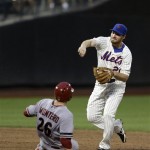 New York Mets second baseman Daniel Murphy, right, turns a double play over Arizona Diamondbacks' Miguel Montero during the third inning of the baseball game at Citi Field, Monday, July 1, 2013, in New York. (AP Photo/Seth Wenig)