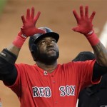 Boston Red Sox designated hitter David Ortiz raises his arms as he crosses home plate on a two-run home run in the first inning during a baseball game against the Arizona Diamondbacks at Fenway Park in Boston, Friday, Aug. 2, 2013. (AP Photo/Charles Krupa)
