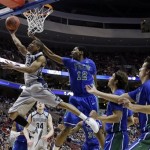 Georgetown's Markel Starks (5) shoots against Florida Gulf Coast's Eric McKnight (12) during the first half of a second-round game of the NCAA college basketball tournament on Friday, March 22, 2013, in Philadelphia. (AP Photo/Matt Rourke)