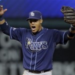 Tampa Bay Rays shortstop Yunel Escobar celebrates after completing a bases-loaded double play against the Cleveland Indians to end the fourth inning in the AL wild-card baseball game Wednesday, Oct. 2, 2013, in Cleveland. (AP Photo/Tony Dejak)