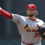 St. Louis Cardinals pitcher Lance Lynn warms up before the first of a spring training baseball game against the Atlanta Braves in Kissimmee, Fla., Monday, March 19, 2012. (AP Photo/Paul Sancya)