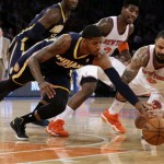 Indiana Pacers' Paul George, left, and New York Knicks' Tyson Chandler compete for the ball in the first half of Game 5 of an NBA basketball playoffs Eastern Conference semifinal, at Madison Square Garden in New York, Thursday, May 16, 2013. (AP Photo/Julio Cortez)
