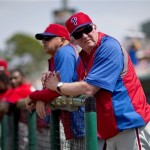 Philadelphia Phillies manager Charlie Manuel stands in the dugout before the start of an exhibition spring training baseball game against the Minnesota Twins, Wednesday, Feb. 27, 2013, in Fort Myers, Fla. After a lengthy tenure in Minnesota, manager Ron Gardenhire enters the last year of his contract, and he's not the only manager under pressure to win this season. Don Mattingly of the Dodgers, Joe Girardi of the Yankees and Charlie Manuel of the Phillies could all be out of a job if their teams don't perform. (AP Photo/David Goldman)