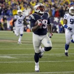 New England Patriots running back LeGarrette Blount (29) heads down field for a 75 yard touchdown run during the second half of an AFC divisional NFL playoff football game against the Indianapolis Colts in Foxborough, Mass., Saturday, Jan. 11, 2014. (AP Photo/Matt Slocum)