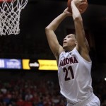 Arizona's Brandon Ashley (21) dunks the ball against Long Beach State in the second half of an NCAA college basketball game, Monday, Nov. 11, 2013 in Tucson, Ariz. (AP Photo/Wily Low)
