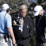 PGA officials Slugger White, right, and Jon Brendle, center, talk with broadcast golf analyst Roger Maltbie gather before the first round at the Tournament of Champions PGA golf tournament, Sunday, Jan. 6, 2013, in Kapalua, Hawaii. Play was to have started two days earlier, but was delayed because of rain and high winds. (AP Photo/Elaine Thompson)