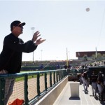  San Francisco Giants manager Bruce Bochy catches a ball from a fan to signs autographs before an exhibition spring training baseball game against the Los Angeles Dodgers on Tuesday, Feb. 26, 2013 in Glendale. Ariz. (AP Photo/Marcio Jose Sanchez)