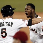 Miami Marlins' Logan Morrison (5) celebrates with teammate Hanley 
Ramirez, right, after Ramirez batted-in the the game-winning run 
against the Arizona Diamondbacks in the ninth inning of a baseball 
game in Miami, Saturday, April, 28, 2012. The Marlins won 3-2. (AP 
Photo/Alan Diaz)
