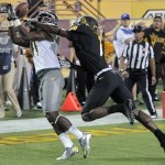 Oregon wide receiver Bralon Addison, left, pulls in a touchdown as Arizona State cornerback Deveron Carr defends during the first half of an NCAA college football game, Thursday, Oct. 18, 2012, in Tempe, Ariz. (AP Photo/Matt York)