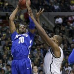 Memphis forward D.J. Stephens (30) shoots over Michigan State forward Adreian Payne in the first half of their third-round game of the NCAA college basketball tournament in Auburn Hills, Mich., Saturday March 23, 2013. (AP Photo/Paul Sancya)
