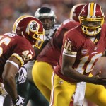 Washington Redskins quarterback Robert Griffin III (10) turns to hand off to running back Alfred Morris during their NFL football game against the Philadelphia Eagles at FedEx Field, Monday, Sept. 9, 2013, in Landover, Md. (AP Photo/The Wilmington News-Journal, Andre L. Smith) NO SALES.