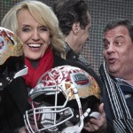 Arizona Gov. Jan Brewer, left, react for photos as New York Gov. Andrew Cuomo, center, and New Jersey Gov. Chris Christie, right, leave after a ceremony to pass official hosting duties of next year's Super Bowl to Arizona, Saturday Feb. 1, 2014 in New York. (AP Photo/Bebeto Matthews)