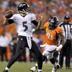 Baltimore Ravens quarterback Joe Flacco (5) throws as Denver Broncos defensive end Robert Ayers (91) pursues during the first half of an NFL football game, Thursday, Sept. 5, 2013, in Denver. (AP Photo/Jack Dempsey)
