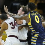  Arizona State's Jordan Bachynski and Jermaine Marshall (34) battle for the rebound during the final seconds as Marquette's Jamil WIlson (0) defends during the second half of an NCAA basketball game, Monday, Nov. 25, 2013, in Tempe, Ariz. Arizona State won 79-77. (AP Photo/Matt York)