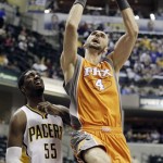 Phoenix Suns' Marcin Gortat shoots against Indiana Pacers' Roy Hibbert during the first half of an NBA basketball game, Friday, March 23, 2012, in Indianapolis. (AP Photo/Darron Cummings)