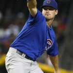 Chicago Cubs' Travis Wood throws against the Arizona Diamondbacks in the first inning of a baseball game on Tuesday, July 23, 2013, in Phoenix. (AP Photo/Ross D. Franklin)