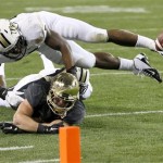 Baylor's Brody Trahan, bottom, can't make the catch on a two-point conversion attempt as Central Florida linebacker Troy Gray defends during the first half of the Fiesta Bowl NCAA college football game Wednesday, Jan. 1, 2014, in Glendale, Ariz. (AP Photo/Ross D. Franklin)