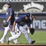 San Diego Padres' Tommy Medica fields a grounder while working out with first baseman Yonder Alonso prior to a baseball game between the Padres and Arizona Diamondbacks Tuesday, Sept. 24, 2013, in San Diego. (AP Photo/Lenny Ignelzi)