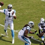 Carolina Panthers quarterback Cam Newton (1) throws a pass under pressure from Seattle Seahawks' Benson Mayowa (95) during the first half of an NFL football game in Charlotte, N.C., Sunday, Sept. 8, 2013. (AP Photo/Mike McCarn)