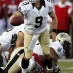 New Orleans Saints quarterback Drew Brees (9) pass the ball under 
pressure from Arizona Cardinals Calais Campbell (93) during the first 
quarter of the Hall of Fame exhibition football game, Sunday, Aug. 5, 
2012 in Canton. (AP Photo/Scott Galvin)