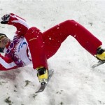 Renato Ulrich, of Switzerland, crashes during the men's freestyle aerials skiing final at the 2014 Sochi Winter Olympics, Monday, Feb. 17, 2014, in Krasnaya Polyana, Russia. (AP Photo/The Canadian Press, Jonathan Hayward)