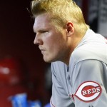 Cincinnati Reds starting pitcher Mat Latos sits in the dugout after being pulled in the eighth inning against the Arizona Diamondbacks during a baseball game on Sunday, June 23, 2013, in Phoenix. (AP Photo/Rick Scuteri)
