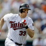 Minnesota Twins' Justin Morneau runs after hitting bases loaded double to bring in three runs in the fourth inning of an exhibition spring training baseball game against the Pittsburgh Pirates, Monday, Feb. 25, 2013, Fort Myers, Fla. (AP Photo/David Goldman)