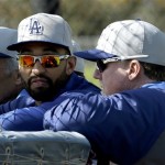Los Angeles Dodgers' Matt Kemp, left, talks with hitting coach Mark McGwire during spring training baseball in Phoenix, Thursday, Feb. 21, 2013. (AP Photo/Paul Sancya)