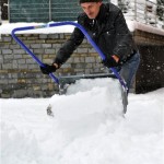 A man clears snow from a driveway in Lofer, in the Austrian province of Salzburg, Monday, Nov. 29, 2010. The snowfall caused traffic problems all over the country. (AP Photo/Kerstin Joensson)