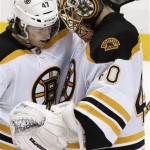 Boston Bruins goalie Tuukka Rask (40) celebrates with Torey Krug after a 6-1 Bruins win over the Pittsburgh Penguins in Game 2 of the NHL hockey Stanley Cup playoffs Eastern Conference finals, in Pittsburgh, Monday, June 3, 2013. (AP Photo/Gene J. Puskar)