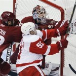 Phoenix Coyotes' Ilya Bryzgalov, top, of 
Russia, makes a glove save on a shot by Detroit 
Red Wings' Valtteri Filppula (51), of Finland, 
as Coyotes' Adrian Aucoin (33) defends during 
the second period in Game 4 of a first-round 
NHL hockey Stanley Cup playoffs series 
Wednesday, April 20, 2011, in Glendale, Ariz. 
(AP Photo/Ross D. Franklin)
