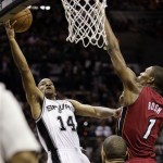 San Antonio Spurs' Gary Neal (14) shoots against Miami Heat's Chris Bosh (1) during the first half at Game 3 of the NBA Finals basketball series, Tuesday, June 11, 2013, in San Antonio. (AP Photo/Eric Gay)