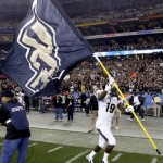 Central Florida wide receiver Josh Reese runs with his school's flag after the Fiesta Bowl NCAA college football game against Baylor, Wednesday, Jan. 1, 2014, in Glendale, Ariz. Central Florida won 52-42. (AP Photo/Ross D. Franklin)