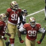 
San Francisco 49ers linebacker Aldon Smith (99), defensive end Ray McDonald (91) and Ahmad Brooks (55) celebrate after Brooks sacked Baltimore Ravens quarterback Joe Flacco (5) during the second half of the NFL Super Bowl XLVII football game, Sunday, Feb. 3, 2013, in New Orleans. (AP Photo/Gerald Herbert)