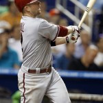 Arizona Diamondbacks' Aaron Hill (2) watches after hitting a solo home run in the sixth inning during a baseball game against the Miami Marlins in Miami, Friday, April 27, 2012. The Diamondbacks defeated the Marlins 5-0. (AP Photo/Lynne Sladky)