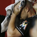 Miami Marlins' Mike Dunn stands in the dugout after giving up a three-run home run to Arizona Diamondbacks' Cody Ross during the eighth inning of a baseball game on Wednesday, June 19, 2013, in Phoenix. The Diamondbacks defeated the Marlins 3-1. (AP Photo/Ross D. Franklin)