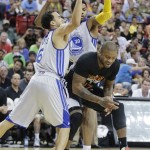 Phoenix Suns' P.J. Tucker (17) is double teamed by Golden State Warriors' Cameron Jones (6) and Kent Bazemore (20) in the fourth quarter of the NBA Summer League championship game, Monday, July 22, 2013, in Las Vegas. The Warriors won 91-77. (AP Photo/Julie Jacobson)
