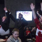 Toronto Mayor Rob Ford, left, celebrates as Sidney Crosby scores Canada's second goal in the Olympic Hockey final in a Toronto bar on Sunday, February 23, 2014. Canada beat Sweden 3-0 to win the gold medal. (AP Photo/The Canadian Press, Chris Young)