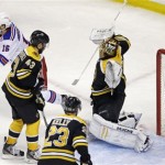 New York Rangers center Derick Brassard (16) celebrates after teammate Ryan McDonagh scored against Boston Bruins goalie Tuukka Rask, right, during the second period in Game 1 of an NHL hockey playoffs Eastern Conference semifinal game in Boston, Thursday, May 16, 2013. (AP Photo/Charles Krupa)