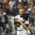 American League's Mariano Rivera, of the New York Yankees, acknowledges a standing ovation during the eighth inning of the MLB All-Star baseball game, on Tuesday, July 16, 2013, in New York. (AP Photo/Matt Slocum)