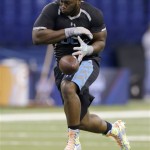 Louisiana Tech defensive lineman IK Enemkpali misses the ball during a drill at the NFL football scouting combine in Indianapolis, Monday, Feb. 24, 2014. (AP Photo/Nam Y. Huh)