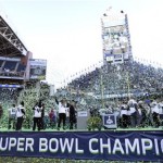Seattle Seahawks players and coaches celebrate as confetti falls during a rally on Wednesday, Feb. 5, 2014, at CenturyLink Field in Seattle. The Seahawks defeated the Denver Broncos on Sunday in NFL football's Super Bowl XLVIII game in East Rutherford, N.J. (AP Photo/Ted S. Warren)