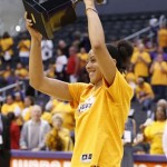 Los Angeles Sparks' forward Candace Parker holds up her WNBA MVP award before the Sparks play the Phoenix Mercury in the opener of their WNBA basketball Western Conference semifinal series on Thursday, Sept. 19, 2013, in Los Angeles. (AP Photo/Danny Moloshok)